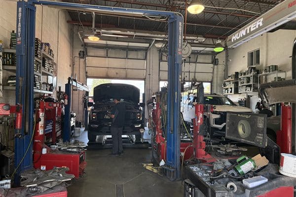 Vehicle on the lift in the Basalt Quick Lube service bay