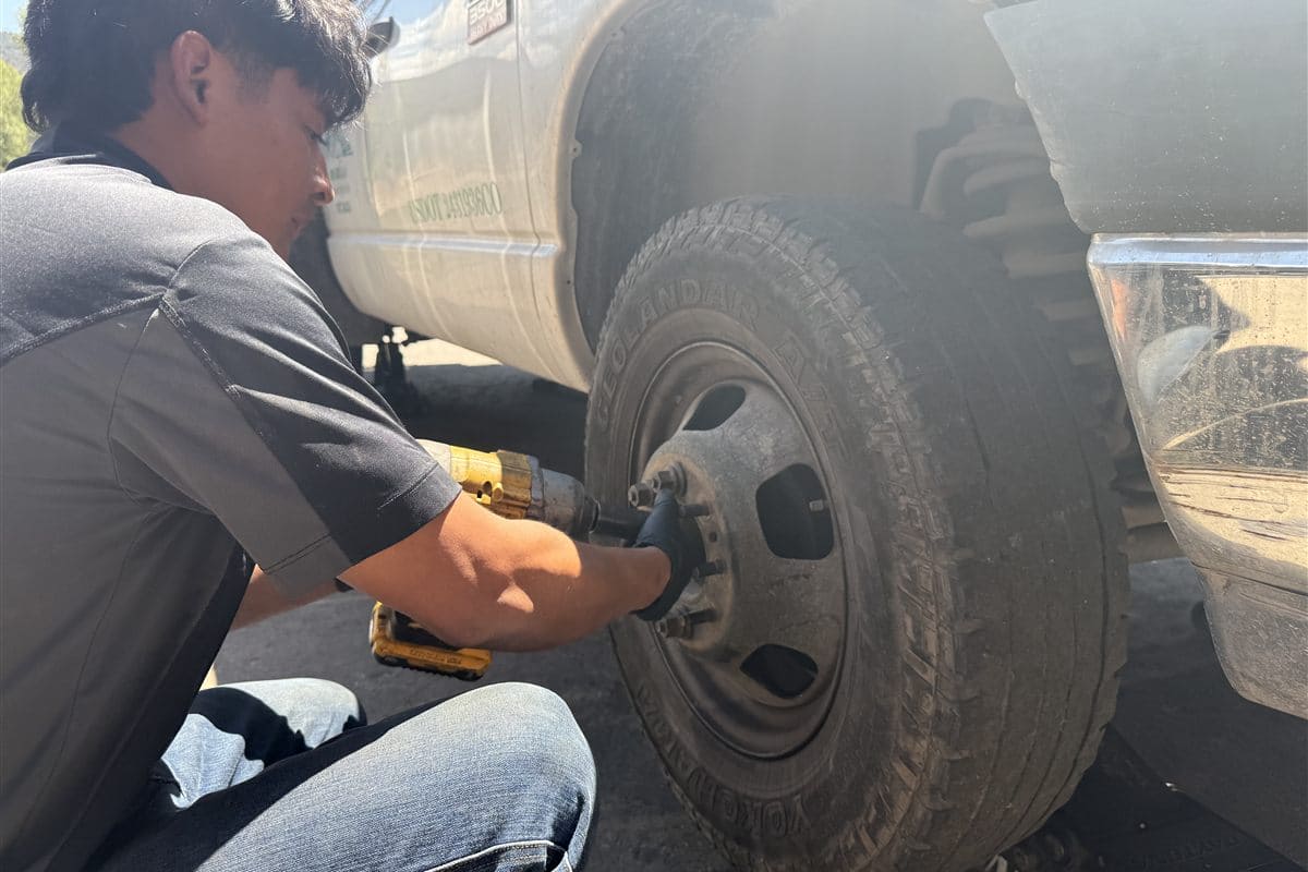 Technician servicing a truck tire in Basalt, CO